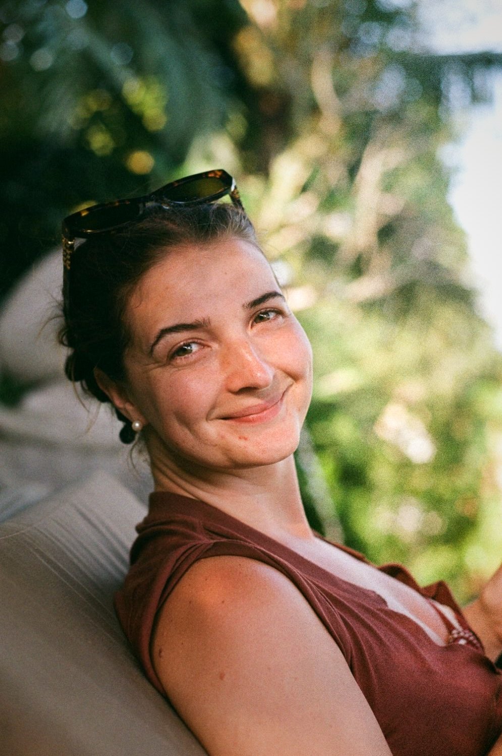 Portrait of a woman with sunglasses on her head, smiling